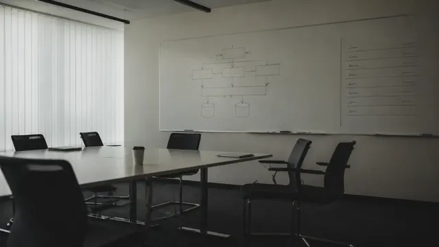 The diagram survives the meeting untouched. The column beside it is the part that mattered. AI-generated cover image; style reference by Michael Pointner on Unsplash.